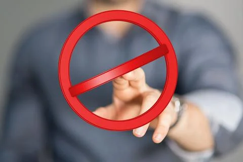 3D render of a red warning sign and a male pointing on a blurry background Stock Photos