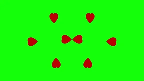 3D render of rotating red hearts on green screen background for romantic chroma Stock Footage 336127651