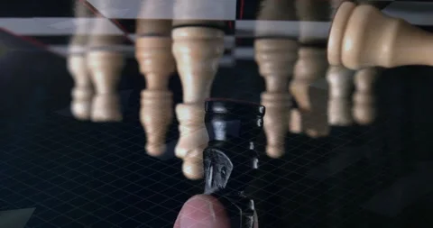 3D render showing black chess king piece being held by finger over grid with 動画素材 307434904