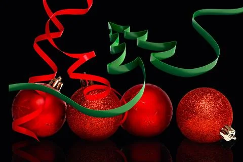 3D render is showing four red baubles on black surface with green ribbon tree, Stock Photos