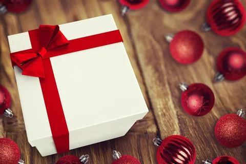 3D render showing white gift box is sitting on wooden tabletop with red ribbon, Stock Photos