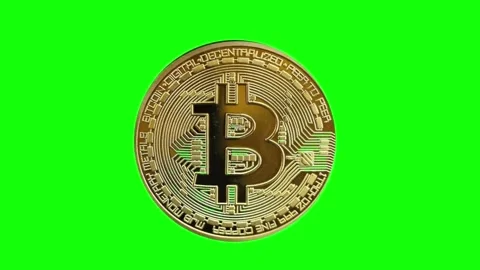 3D render of a smooth rotating Golden bitcoin (real coin, minted) on a green bac Video stock 265149369