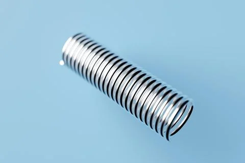 3d render of a stainless steel spring on  bluee background 스톡 일러스트