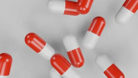 3D render. tablets in capsules of red and white color fall overnight. health con Video stock 163771151