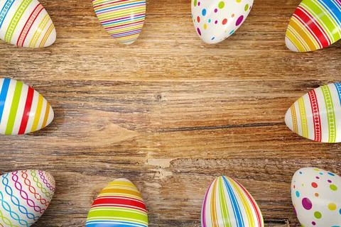 3d render - ten colorful easter egg on dark wood table Stock Illustration