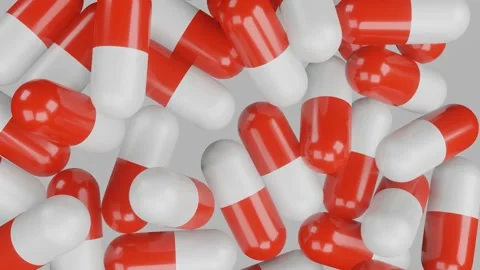 3D render. top view of tablets in capsules of red and white color rotate on a li Video stock 163771070
