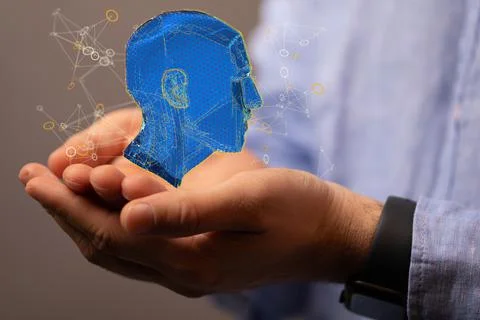 3D rendered Artificial Intelligence held in a person's hand Stock Photos