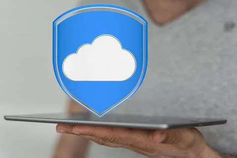 3D rendered cloud icon over a tablet in a male hand Foto stock