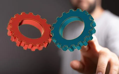 A 3D rendered engineering and design image gears with a male hand in the back Fotos de archivo