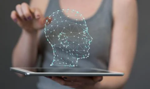 3D rendered human head hovering over a tablet - artificial intelligence conce Stock Photos