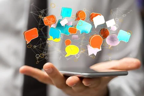 3D rendered speech bubbles hovering over a smartphone Stock Photos