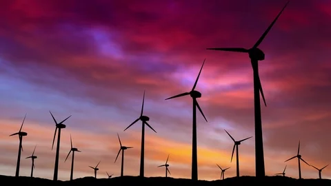 3D Rendered Wind Turbine Farm at Sunset with Colorful Red and Orange Sky Stock Footage 101944710