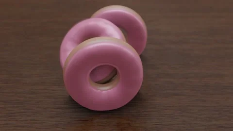 3D rendering of 3 donuts falling and falling over Stock Footage 165252002