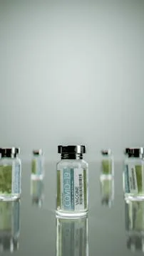 3D rendering of an array of small vials of a vaccine against a solid gray backgr 写真素材