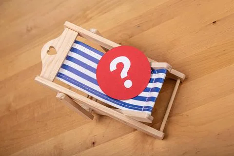 3D rendering of a beach chair with question mark- beach summer vacation conce Stock Photos