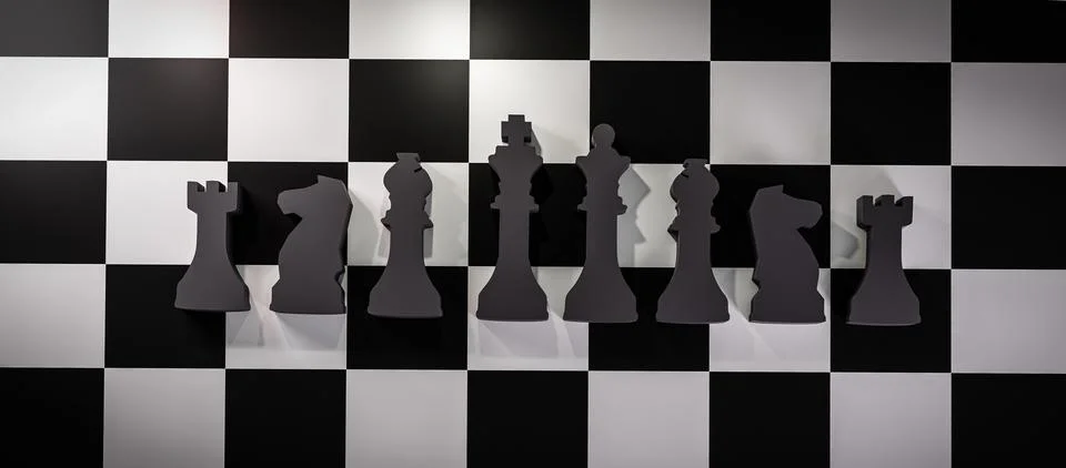 3D rendering of the chess black figures isolated on the game board background Stock Illustration
