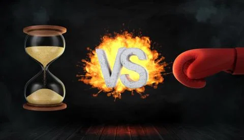 3d rendering of a concrete letters VS caught on fire between an hourglass and a Stock Illustration