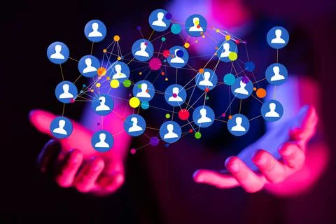 A 3D rendering data network floating on a businessman's hand against a dark b Stock Photos
