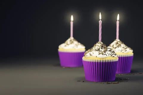 3d rendering of delicious cupcakes with burning candles Illustrazione stock