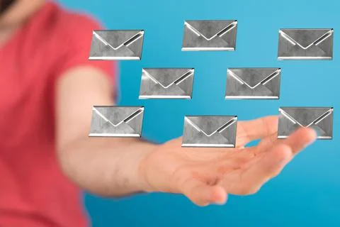 A 3D rendering of digital envelopes floating on hand- online communication co Stock Photos