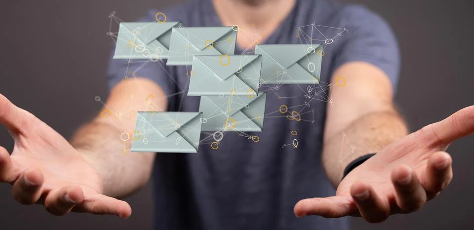 A 3D rendering of digital envelopes floating in between hands- online communi 스톡 사진