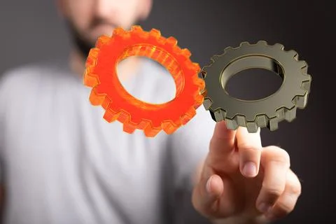 A 3D rendering of digital gears with hand touching it from behind-business ge Stock Photos