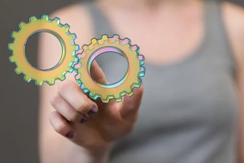 A 3D rendering of digital gears with hand touching it from behind-business ge Stock Photos