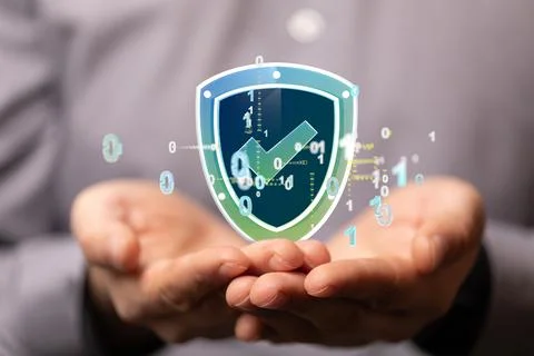 A 3D rendering of digital shield with check floating over hands-cybersecurity Stock Photos