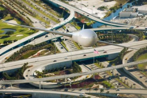 3D rendering of a drone surveilling traffic over the freeway Illustrazione stock