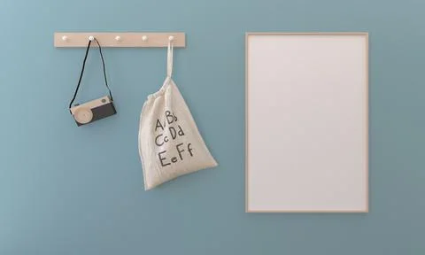 3D rendering of an empty frame next to a camera and bag on a blue background Illustrazione stock