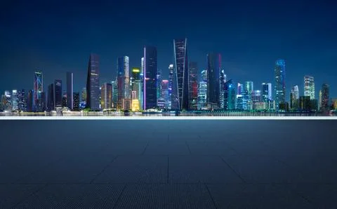 3D rendering empty square floor and city skyline at night Stock Photos