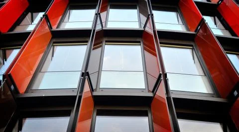 3D rendering of a facade of a modern building with red walls and many windows Ilustración de archivo