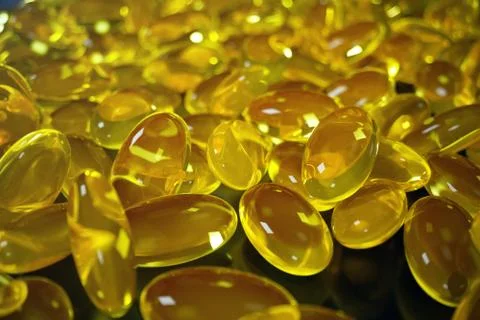 3D Rendering Fish Oil. Omega 3, omega 6, omega 9, vitamin D. Pile of capsules Stock Illustration
