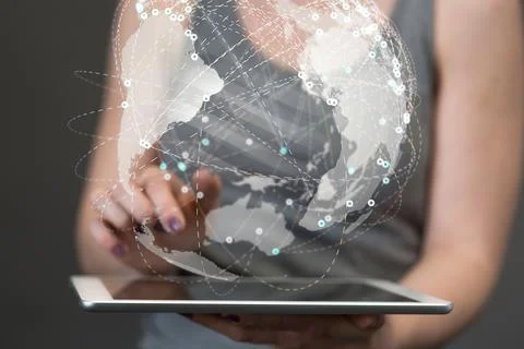A 3D rendering of a globe hologram with interconnected dots on a businesswoma Stock Photos