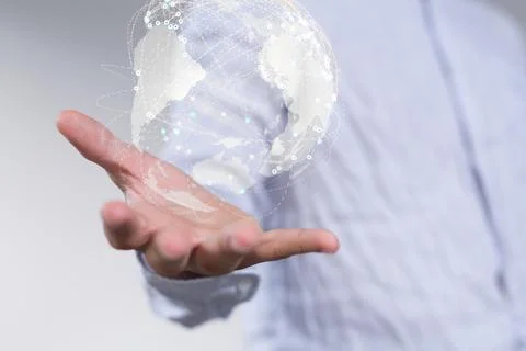 A 3D rendering of a globe hologram with interconnected dots on a businessman' Stock Photos