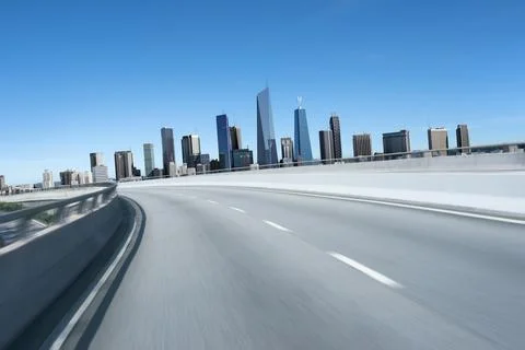 3d rendering Highway overpass motion blur with modern city Stock Photos
