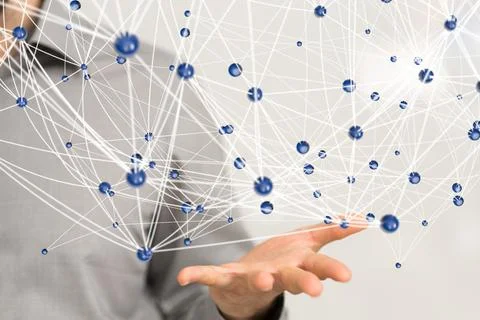 A 3D rendering hologram of interconnected dots on a businessman's palm - netw Stock Photos