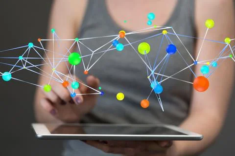 A 3D rendering hologram of interconnected dots projecting from a businesswoma Stock Photos