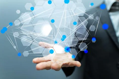 A 3D rendering hologram of a network of hexagons on a person's palm against a Stock Photos