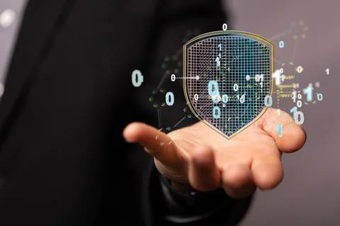 3D rendering of a hologram of a shield with binary numbers above a person's hand Stock Photos