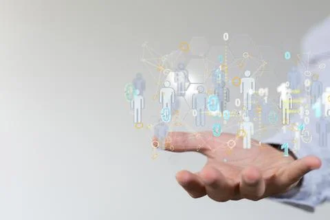 3D rendering of human icons with binary codes over a hand-social network communi 写真素材