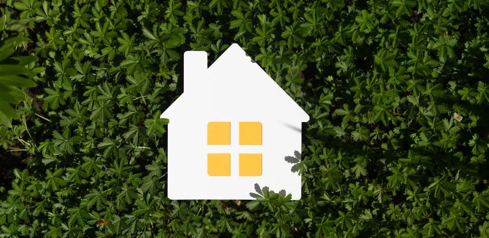 A 3d rendering of an implied flat lay design with a miniature white toy house Illustrazione stock