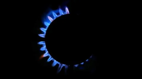 3D rendering of a kitchen burner glowing at night, close up Illustrazione stock