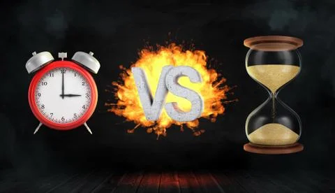 3d rendering a large flaming word VS stands between a red retro alarm clock and イラスト素材