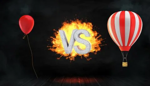 3d rendering of a large flaming word VS stands between a red party balloon and a Stock Illustration