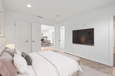 3D rendering of a modern master bedroom interior with white bed and wooden floor Stock Illustration