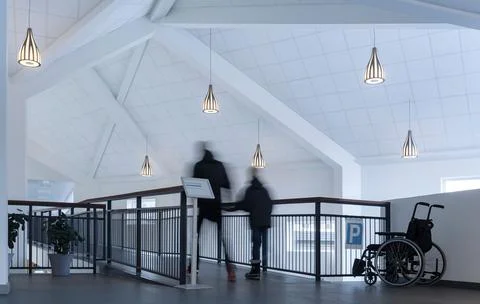 3D rendering of pendant lamps hanging from a white ceiling above a corridor with Ilustración de archivo
