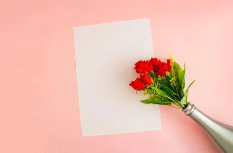 3D rendering red roses in the bottle over the blank piece of paper against paste Stock Photos