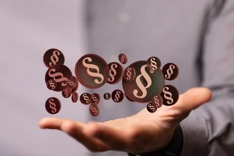 A 3D rendering of section signs over a real person's hand - law and justice c Foto stock