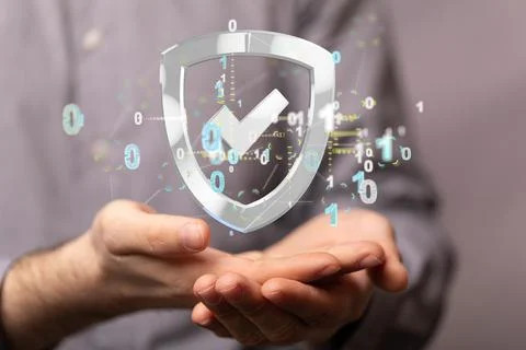 A 3D rendering of a shield with binary codes floating over hands- Certified G Stock Photos